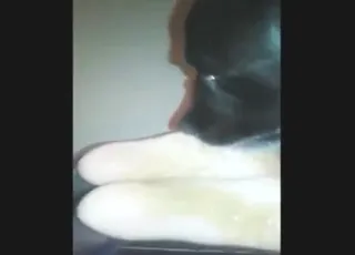 black dog licks her feet in a hot zoo porn vid